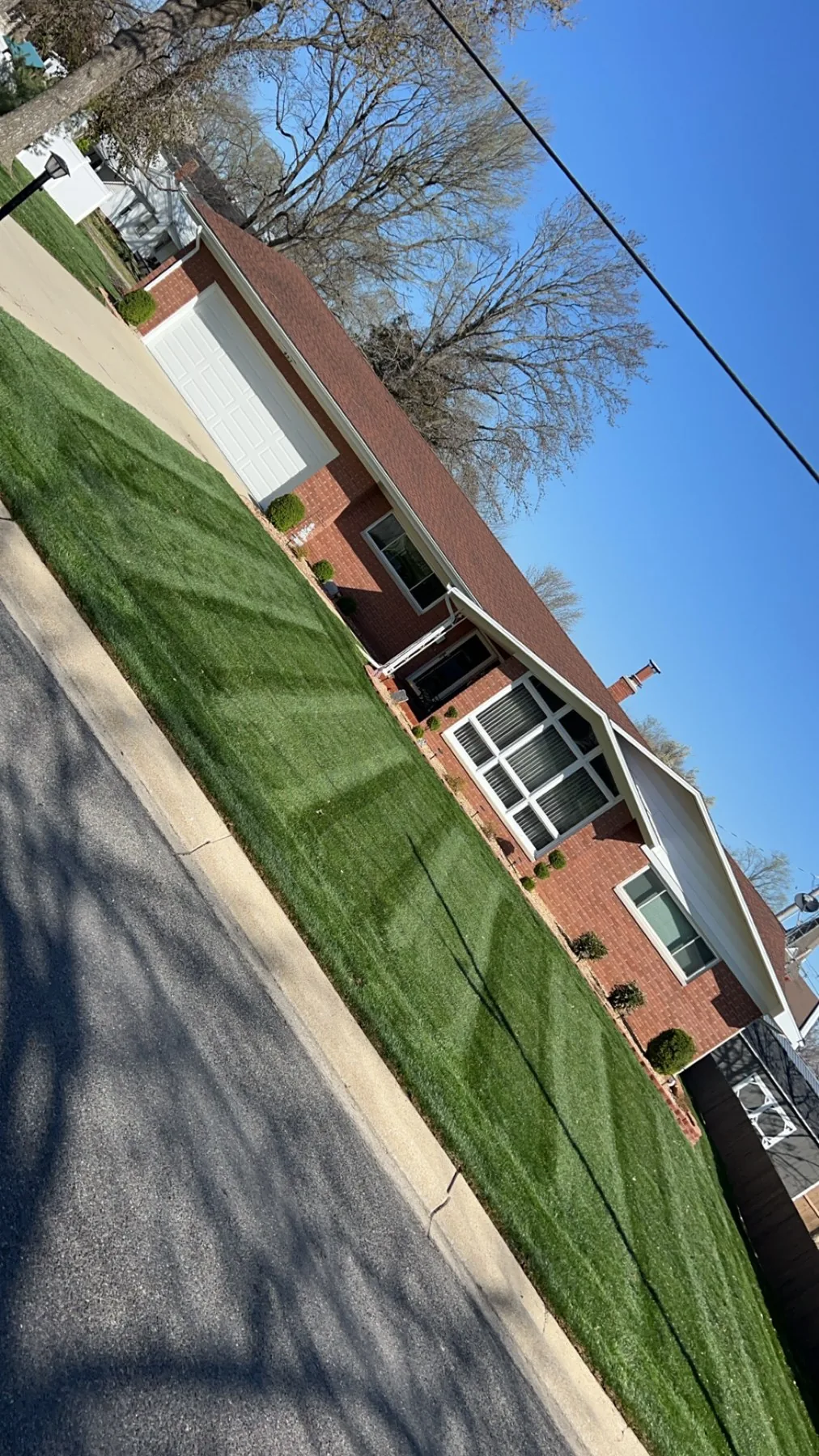 Tidy home lawn kept green through the season