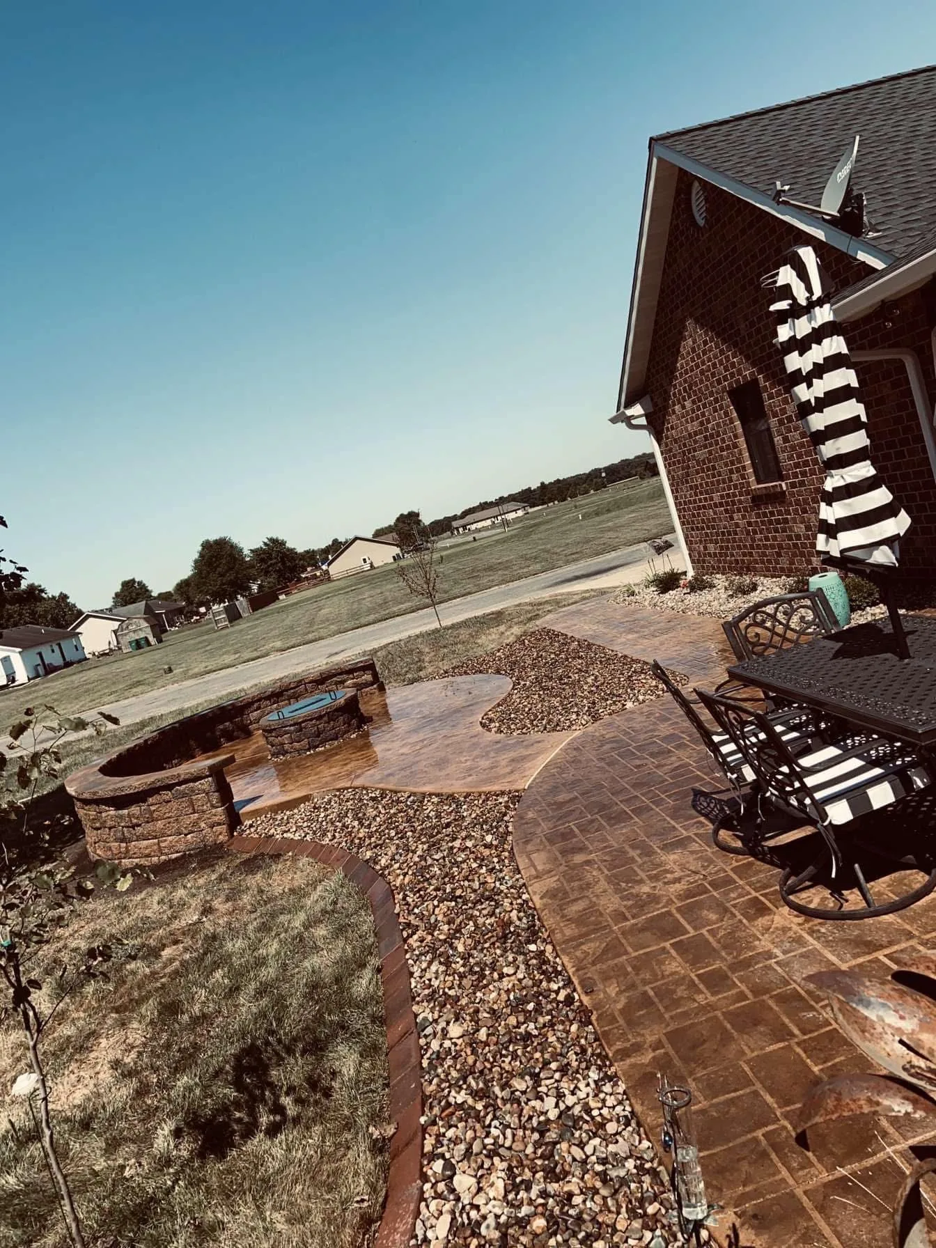 Paver patio with a fire feature and outdoor seating